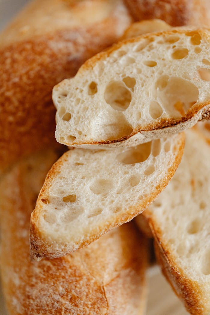 Crafting Captivating Headlines: Your awesome post title goes here Detailed view of freshly baked bread with a golden crust, sliced and ready to eat.
